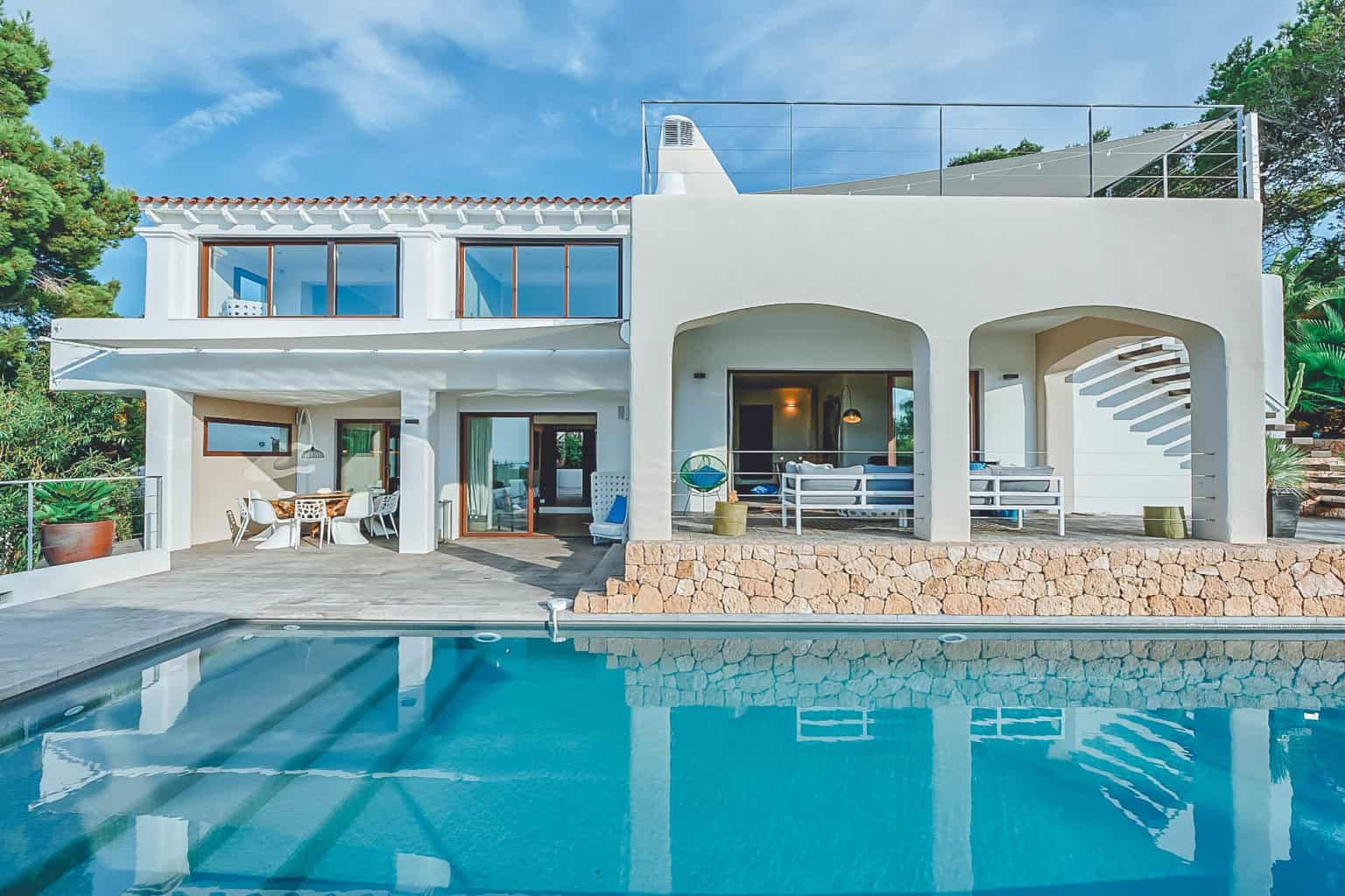 Villa Rental Ibiza - 5 Bedrooms - Balearic Bliss - Can Chloe - pool with villa behind